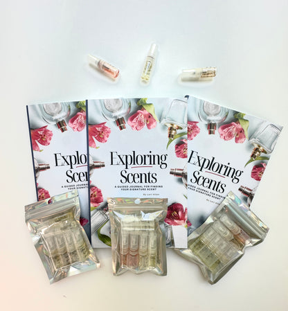 Three Exploring Scents books and three hologram packages of fragrance samples.